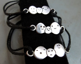 pulseira et bague au petit monde