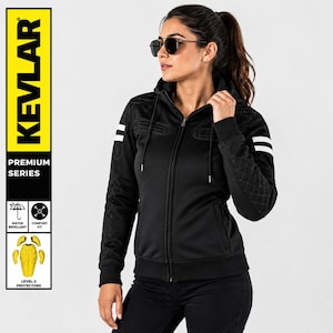 May include: A black zip-up hoodie featuring a hood with drawstrings, quilted detailing on the shoulders and sleeves, and two horizontal white stripes on each upper arm. The garment includes a vertical yellow panel with the text KEVLAR PREMIUM SERIES.