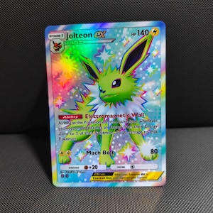 shiny jolteon pokemon card Celebrate the incredible history of the TCG hobby by adding this Jolteon 1999 Pokemon Jungle 1st Edition Holo Rare #4 PSA Authenticated 7 Card to your vault Jolteon Star Gold Metal Pokemon