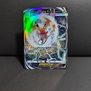 May include: A holographic Mega Raichu Y EX trading card with 330 HP. The card features a central illustration of the yellow electric-type creature surrounded by lightning, with the text Plasma Burst, 280 damage, and Mega Evolution ex rule.
