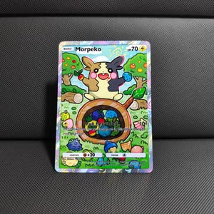 May include: A Morpeko Pokémon trading card with a colorful illustration. The card features a cartoon character holding fruit, with the text "Full Belly Bolt" and other game-related details. The card has a HP of 70.