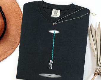 Astronaut Climbing Rope Graphic Tee, Surreal Space Portal Art Shirt, Cosmic Sci-Fi Gift for Astronomer, Minimalist Galaxy Exploration