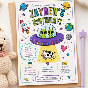 May include: A rectangular birthday invitation card featuring space-themed illustrations including a rocket, planets, and two green aliens in a purple UFO abducting a cow. The text reads ZAYDEN'S BIRTHDAY, JOIN US FOR AN OUT-OF-THIS-WORLD CELEBRATION, and event details.
