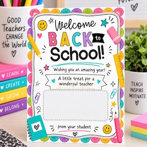 May include: A rectangular card with a white background and a colorful scalloped border. The text reads Welcome BACK to School! Wishing you an amazing year! A little treat for a wonderful teacher from your student. It features illustrations of a pencil, eraser, ruler, paperclip, and smiley faces.