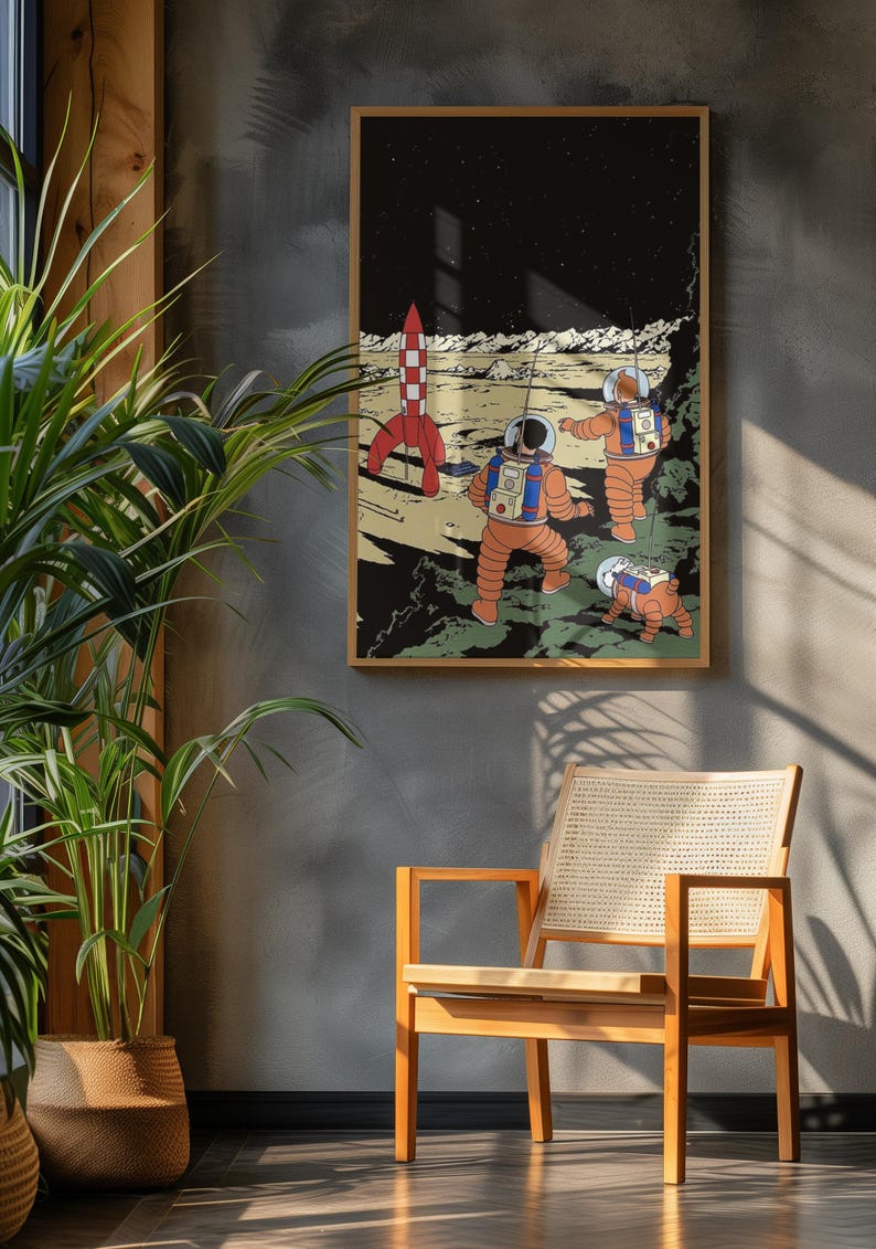 May include: A framed art print featuring a retro-style illustration of astronauts exploring a lunar landscape. The artwork depicts a red and white rocket, three astronauts in orange suits, and a small robot on the moon's surface. The background is a starry night sky.