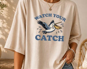 Funny Pelican Shirt, Watch Your Catch Tee, Bird Graphic Top, Beach Lover Apparel, Ocean Wildlife Tshirt, Nautical Humor Shirt, Vacation Wear