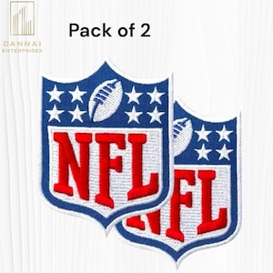 May include: Two embroidered NFL shield patches. Each patch features a blue border, white stars, a white football, and the red letters "NFL". The patches are on a white background. The text "Pack of 2" is above the patches.