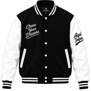 May include: A black and white varsity jacket featuring white sleeves and a black body. The front displays the text "Chase Your Dreams" in white script, while the left sleeve features "Aizal Impex" in black script. It has a snap-button closure.