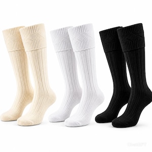 May include: Three pairs of knee-high socks in beige, white, and black. Each pair features a ribbed texture throughout the leg and foot, with a decorative diamond-patterned knit band at the top cuff. The socks are displayed in a side-profile view.