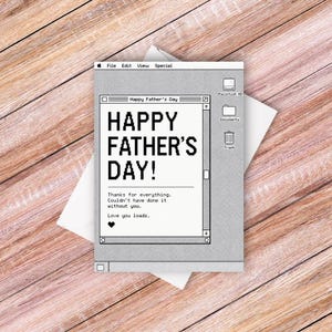 May include: A rectangular greeting card featuring a retro computer desktop interface design in shades of gray. The screen displays the text Happy Father's Day, Thanks for everything. Couldn't have done it without you. Love you loads. with a heart icon.