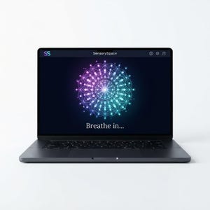 May include: A dark gray laptop displaying the SensorySpace interface on its screen. The screen features a glowing, multicolored mandala graphic in shades of purple, blue, and teal, with the white text "Breathe in..." centered below it.