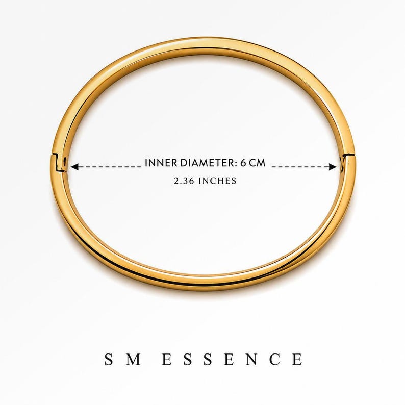 May include: A gold-colored bangle bracelet with a clasp closure. The inner diameter is 2.36 inches (6 cm). The bracelet is circular and sits on a white background. The brand name "SMESSENCE" is at the bottom.