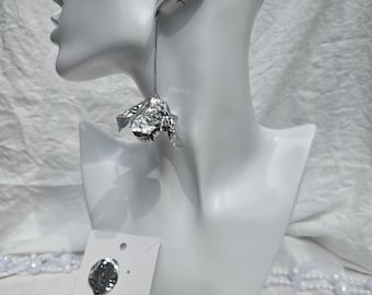 Silverstone metal earrings feature long snake chains attached to hammered, petal-shaped pendants