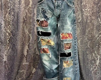 Upcycled tattered jeans. Distressed with patches.