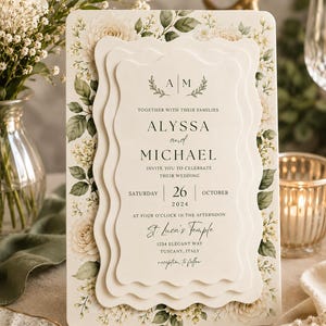 May include: A layered wedding invitation with a floral design. The invitation features the names "Alyssa and Michael" and the date "October 26, 2024". The text also includes the location "St. Luca's Temple, Tuscany, Italy".