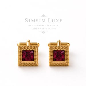 May include: A pair of gold cufflinks featuring a square-cut deep red gemstone set within a textured gold frame. Above the cufflinks, the text reads SIMSIM LUXE FINE GEMSTONE JEWELLERY JAIPUR ESTD IN 1990, presented in a clean, professional font.