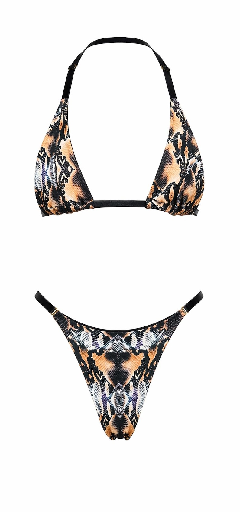 May include: A two-piece bikini set featuring a brown, black, and white snakeskin print. The top is a triangle style with black straps and gold-tone hardware. The bottom is a high-cut style with matching black straps and gold-tone hardware connectors.