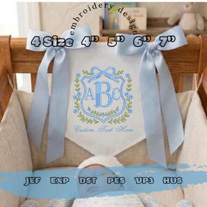May include: A white banner with a blue embroidered monogram and floral design, tied with light blue ribbons. The banner has the text "4 Size 4" 5" 6" 7" and "Custom Text Here". Embroidery design files are listed at the bottom.