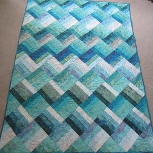 PDF Pattern Ocean Rail Fence Waves twin and queen sized quilt is easy and fun, made from medium, dark, and light batiks in green blue purple image 1