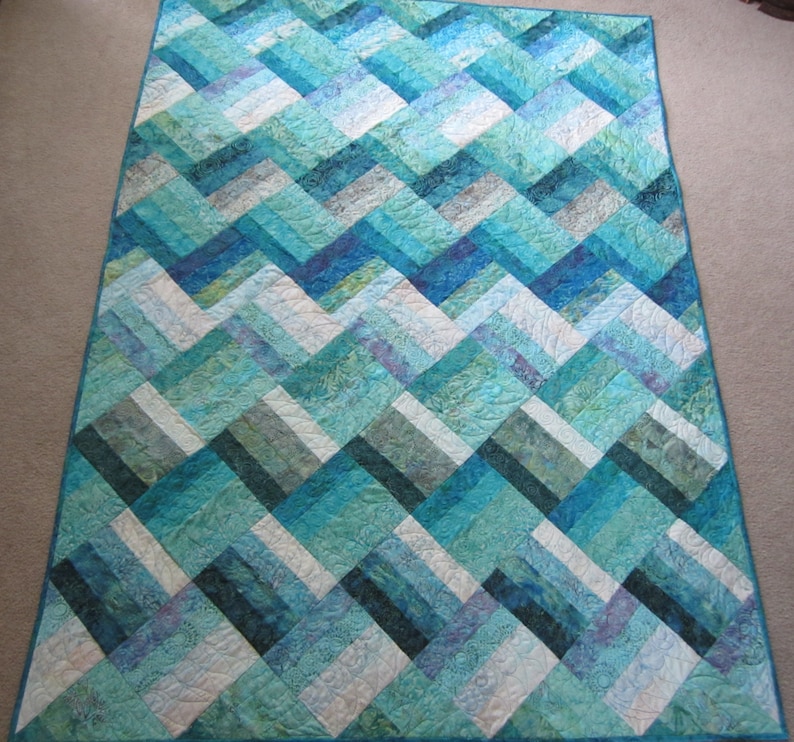 PDF Pattern Ocean Rail Fence Waves twin and queen sized quilt is easy and fun, made from medium, dark, and light batiks in green blue purple image 1