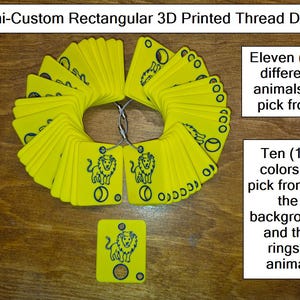 May include: Yellow rectangular 3D printed thread drops arranged in a circle, featuring a lion design. The image includes text indicating eleven animal designs and ten color options for the background and rings.