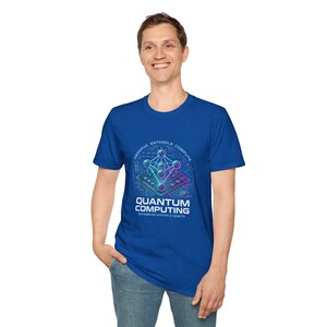 May include: Royal blue t-shirt featuring a graphic design related to quantum computing. The design includes a network of interconnected spheres and lines, with the words "Observe, Entangle, Compute" and "Quantum Computing" printed on the shirt.