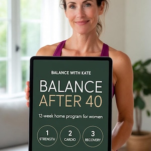 May include: A woman holding a tablet displaying "BALANCE AFTER 40", a 12-week home program. The tablet screen is dark green with white text, including "Strength", "Cardio", and "Recovery" icons. The woman wears a purple top.