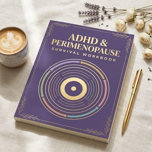 May include: A purple workbook titled "ADHD & Perimenopause Survival Workbook" with gold accents and a circular design. A gold pen rests beside the book, with a cup of coffee and flowers in the background.