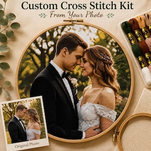 May include: A custom cross stitch kit featuring a circular wooden embroidery hoop containing a stitched portrait of a couple in wedding attire. The kit includes a printed original photo, a set of colored embroidery floss, and a blank hoop.