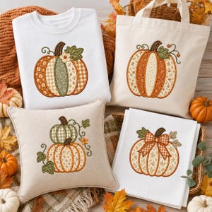 May include: A white sweatshirt, a beige canvas tote bag, a beige throw pillow, and a white kitchen towel, each featuring embroidered pumpkin designs with various autumn-themed fabric patterns, including gingham, floral, and solid orange and green.