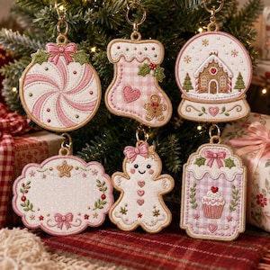May include: Six embroidered Christmas ornaments featuring a pink and white color palette. Designs include a peppermint swirl, a stocking with a gingerbread man, a snow globe with a house, a scalloped gift tag, a gingerbread person, and a cupcake.