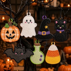 May include: A set of seven embroidered Halloween ornaments featuring a plaid pumpkin, a white ghost, a black witch hat, a black cat, a dark bat, a light green potion bottle, and a candy corn, each with a black hanging loop and a circular top.