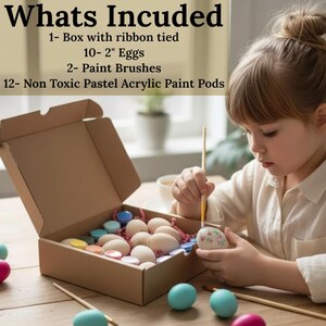 May include: A craft kit with a cardboard box containing 10 eggs, paint pods, and paint brushes. The text "Whats Included" is at the top. A child is painting an egg with a brush. Several painted eggs are on the table.