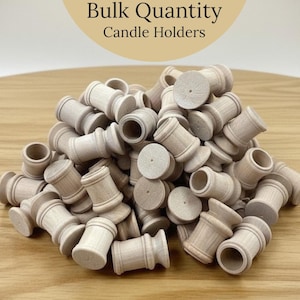 May include: A collection of unfinished wooden candle holders. The candle holders are cylindrical with a flared base and top. The image includes the text "Bulk Quantity Candle Holders".