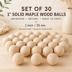 May include: A collection of 30 unfinished, natural 2.5 cm solid maple wood balls. The smooth-finished balls are ready for crafts and DIY projects. The image text reads "SET OF 30 1" SOLID MAPLE WOOD BALLS".