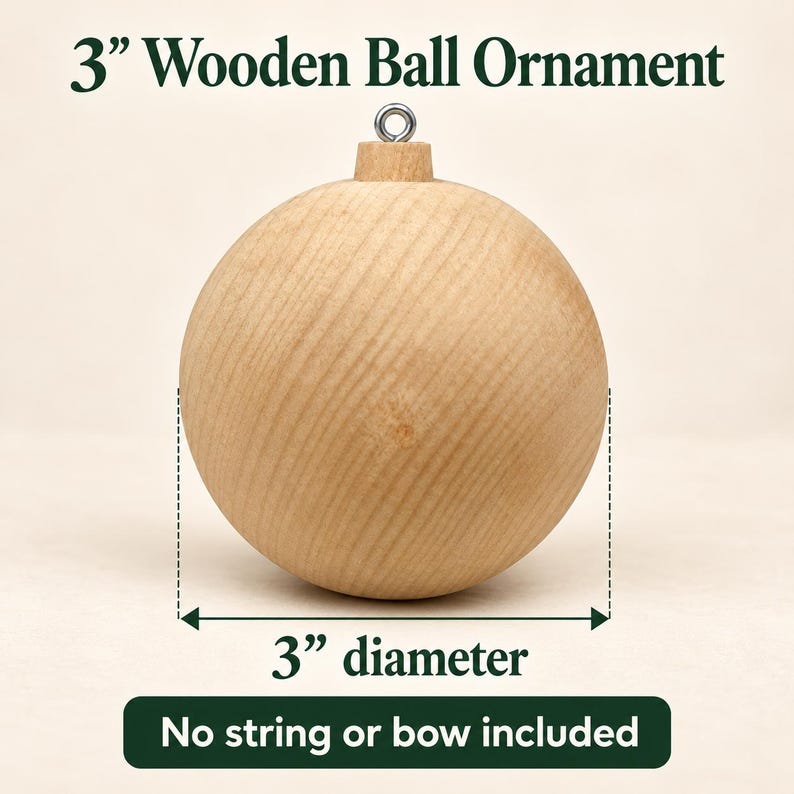 May include: A 3-inch diameter wooden ball ornament with a natural light wood grain finish and a silver-colored metal eyelet at the top. The text 3" Wooden Ball Ornament, 3" diameter, and No string or bow included is visible.