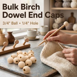 May include: A collection of light-colored, spherical birch wood dowel end caps with a central hole. The text on the image reads Bulk Birch Dowel End Caps, 3/4 inch ball, 1/4 inch hole. These wooden components are shown alongside a knitting project.