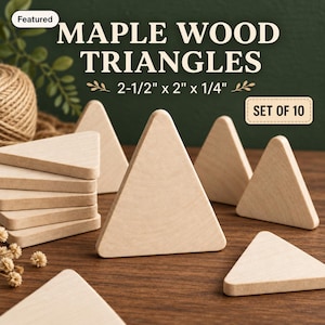 May include: A set of 10 light-colored maple wood triangles, each measuring 2-1/2 inches by 2 inches by 1/4 inch. The pieces are arranged in a group, with some stacked and others standing upright, displaying a smooth, unfinished natural wood grain.