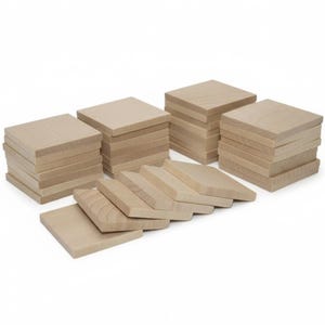 May include: Several stacks of unfinished, square wooden blocks. The blocks are light brown in color and appear to be made of natural wood. Some blocks are stacked, while others are arranged in a row, suggesting a craft or DIY project.