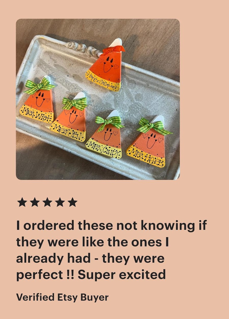May include: Five triangular candy corn ornaments with white tops, orange centers, and yellow bases. Each features a hand-painted smiling face, a green and white gingham bow, and the names Mrs. Wist, Mrs. Jen, Mrs. Cindy, Mrs. Hare, and Happy Halloween.