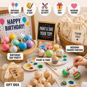 May include: A collection of wooden spinning tops in various colors and patterns, including plain wood, painted stripes, and polka dots. The set includes paint palettes, brushes, small gift bags, and signs with text like Happy Birthday and Paint & Take Your Top.