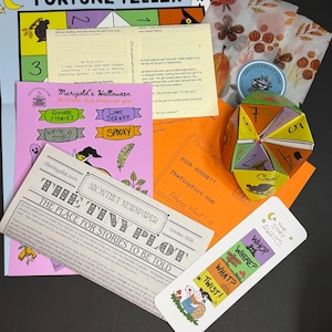 May include: A collection of printed paper items including a Fortune Teller game, a pink Marigold's Halloween activity sheet, a newspaper titled The Tiny Plot, an orange envelope, a folded paper fortune teller, and a bookmark labelled Your Story Awaits.