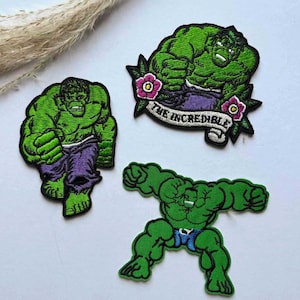 May include: Three green Hulk patches. One patch shows Hulk walking, wearing purple pants. Another patch shows Hulk with the text "THE INCREDIBLE" on a banner. The third patch shows Hulk with arms and legs spread.