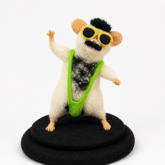 A needle-felted mouse dressed in a Borat mankini — this is peak absurdist handcraft and I cannot believe it exists.