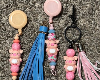 Piggy Lanyards, Backpack hooks, Bookmarks, Cup markers and Keychains