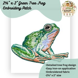 May include: An embroidered patch featuring a green tree frog with light green, dark green, and pale orange details. The patch measures 2 3/8 inches by 2 inches and displays a detailed frog design with a prominent eye and textured stitching.