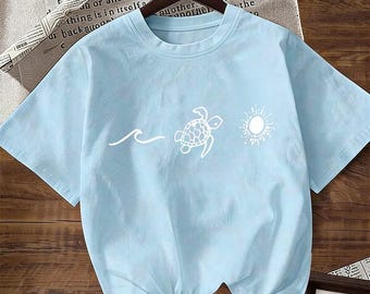 Camiseta rosa fucsia con estampado de plantas, 100% algodón, ideal para el verano y para niñas preadolescentes.