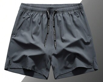 Pantalones cortos deportivos burdeos para hombre, con cordón ajustable y bolsillos.