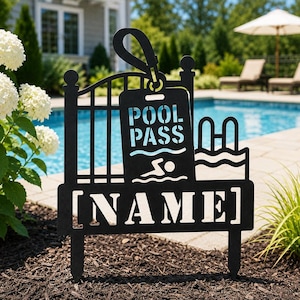 May include: A black metal garden stake featuring a cutout design of a pool pass tag, a swimming figure, and a pool ladder. The sign includes the text POOL PASS and a bracketed section with the word NAME, supported by two pointed stakes.