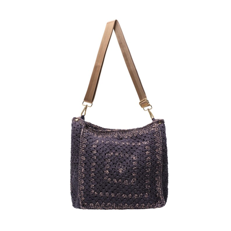 May include: A dark purple crochet shoulder bag featuring a square pattern design with a textured surface. The bag includes a light brown adjustable nylon strap attached with gold-toned metal swivel clasps on both sides of the top opening.